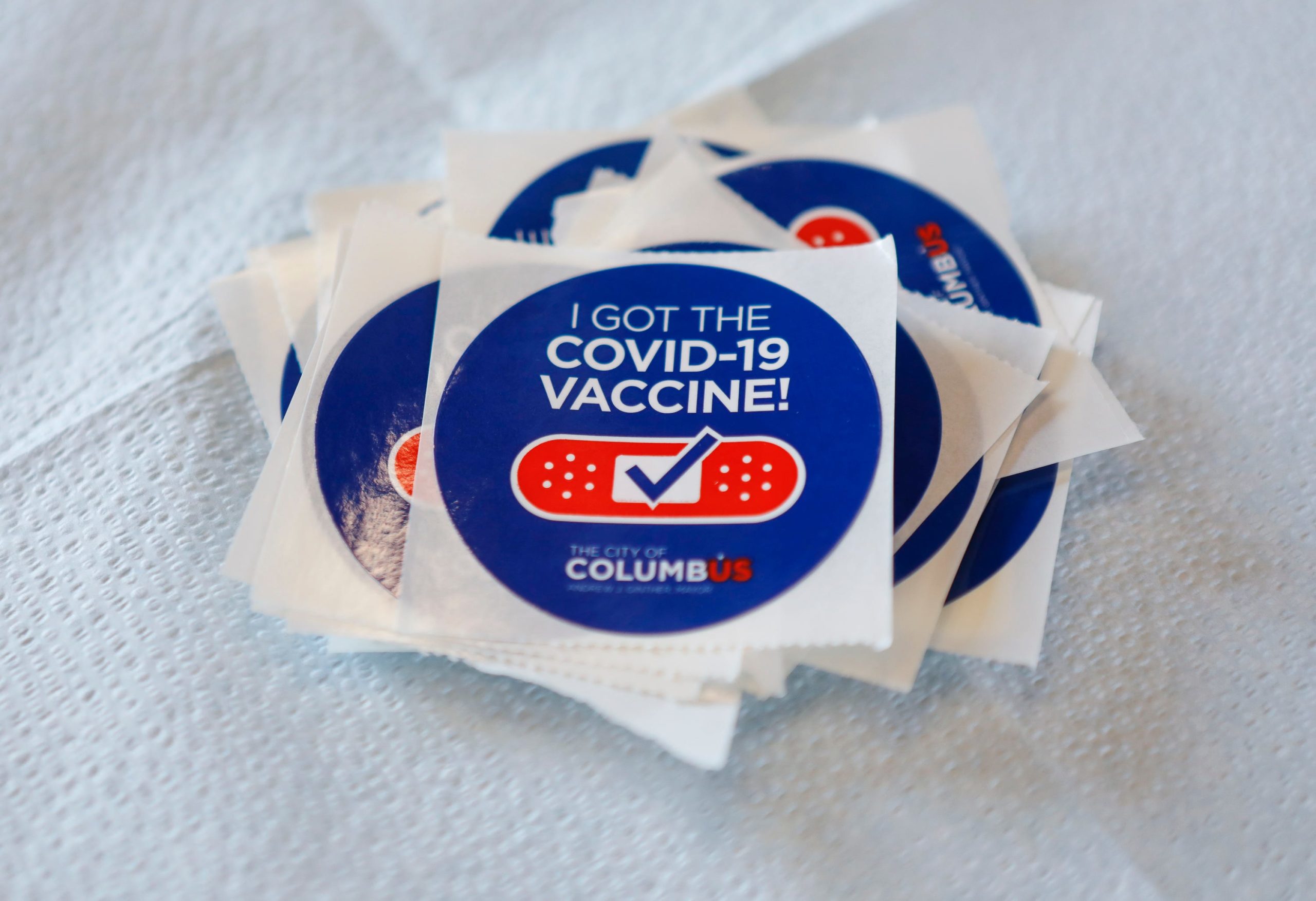 COVID-19 vaccination stickers sit in waiting during the Columbus Public Health drop-in clinic at Stonewall Columbus in the Short