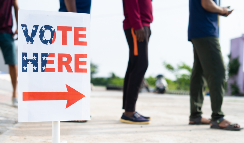 Image of people standing in line to vote.