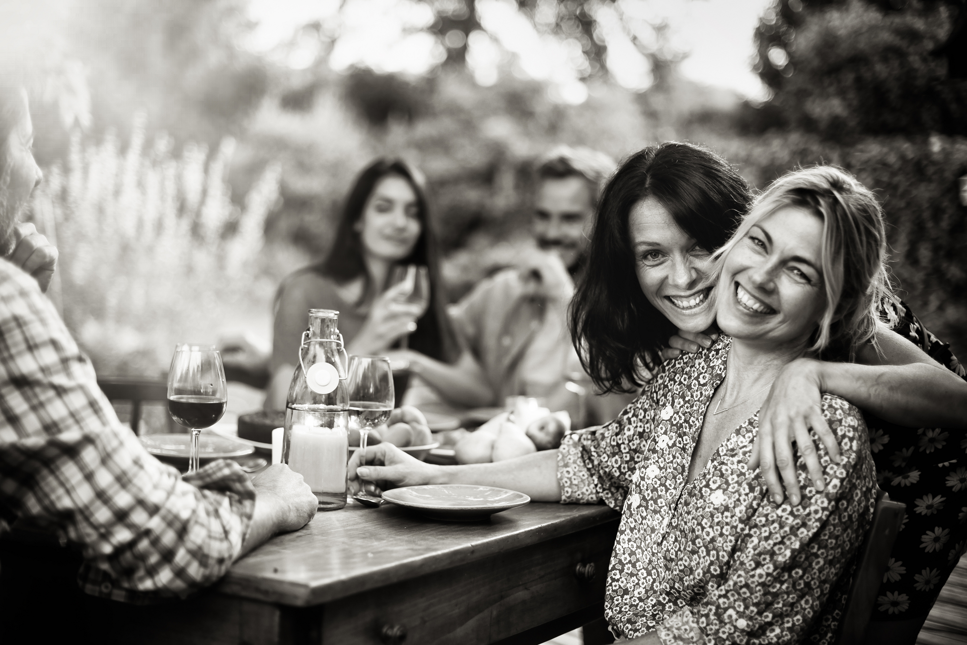 Image of young people enjoying a meal outside.