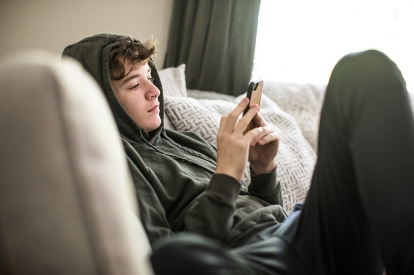 Teenage boy texting