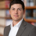 Daniel A Cox